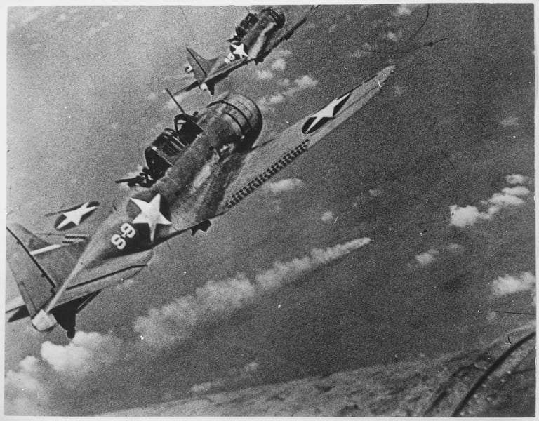Navy fighters during the attack on the Japanese fleet off Midway, June 4th to 6th 1942. In the center is visible a burning Japanese ship