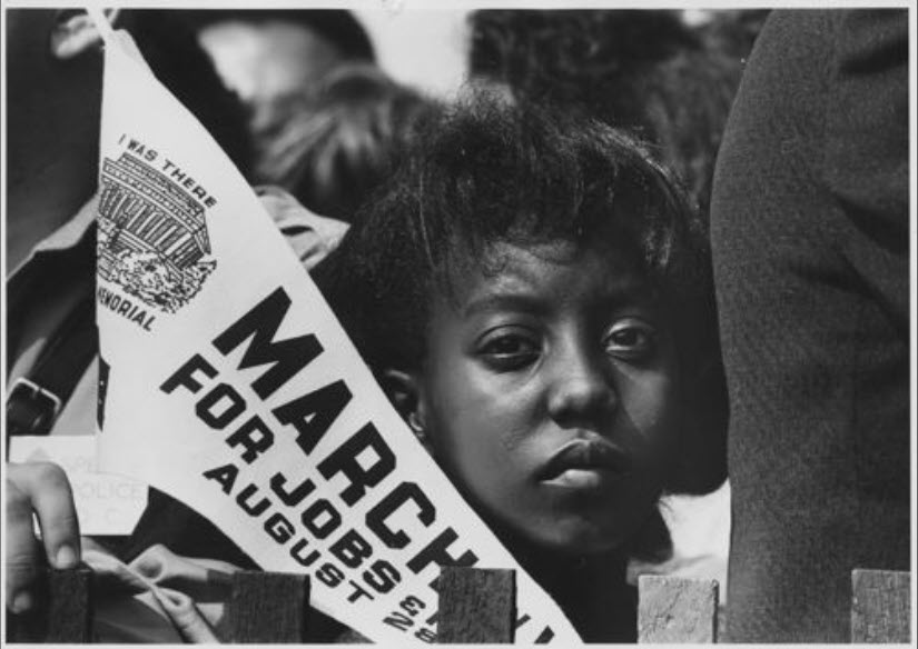 Photograph of a Young Woman at the Civil Rights March on Washington, DC, with a Banner