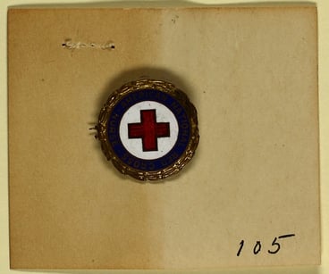 Circular red cross pin