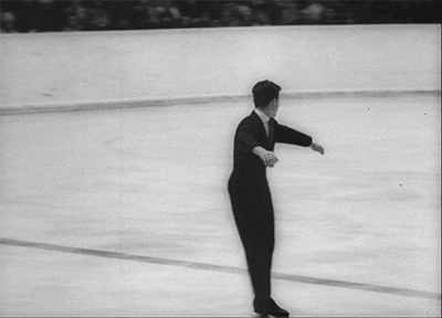 Olympic figure skater spins during competition
