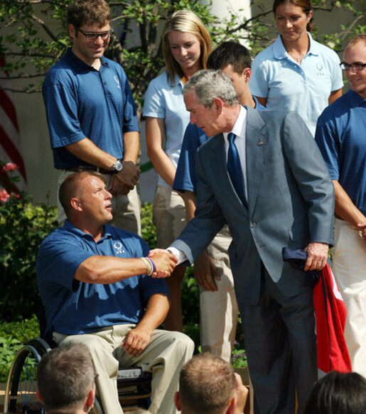President George W. Bush Shakes Hands with U.S. Paralympics Track and Field Team Member Scott Winkler, National Archives Identifier, 176248219 