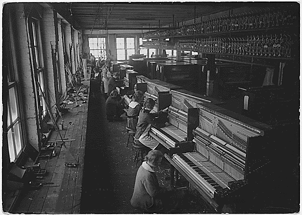 Cable Piano Company. Row of girl key fitters. Operation in manufacturing of pianos. National Archives Identifier 522860