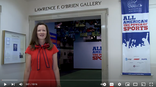 Screen capture of Curator Alice Camps giving a video tour of the All American Sports exhibit