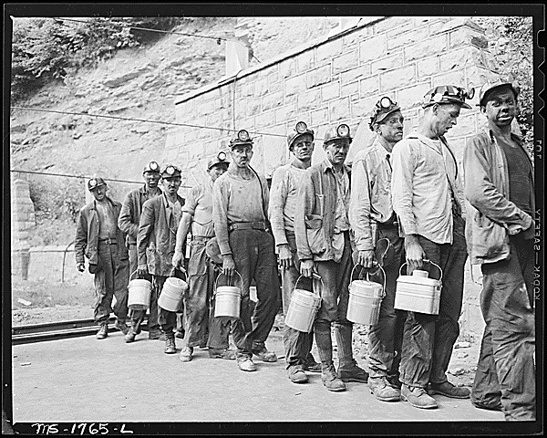 Miners checking in at the lamp house at completion of morning shift. Koppers Coal Division, Kopperston Mines, Kopperston, Wyoming County, West Virginia. National Archives Identifier 540922